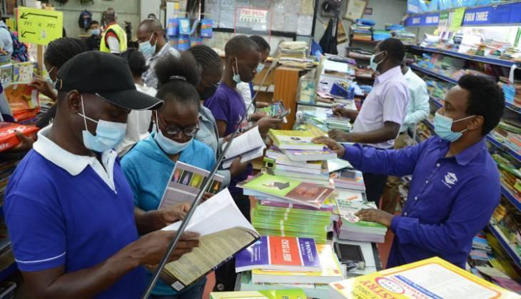 File image of Parents buying books at a bookshop.